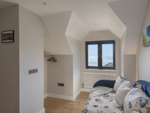 Bedroom 6: 2 singles/sofa